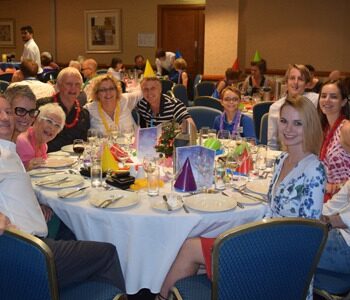 Table of people at a corporate event