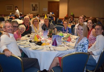 Table of people at a corporate event