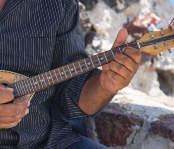 man playing greek music