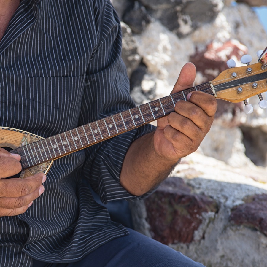 man playing greek music